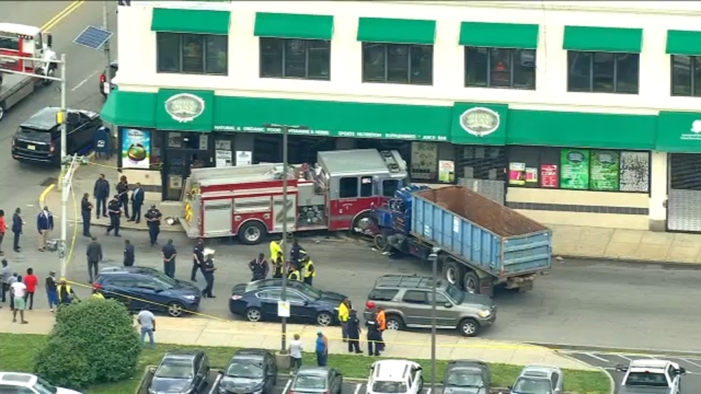 Firetruck, truck crash into building injuring 5 people, including 3 firefighters in NJ