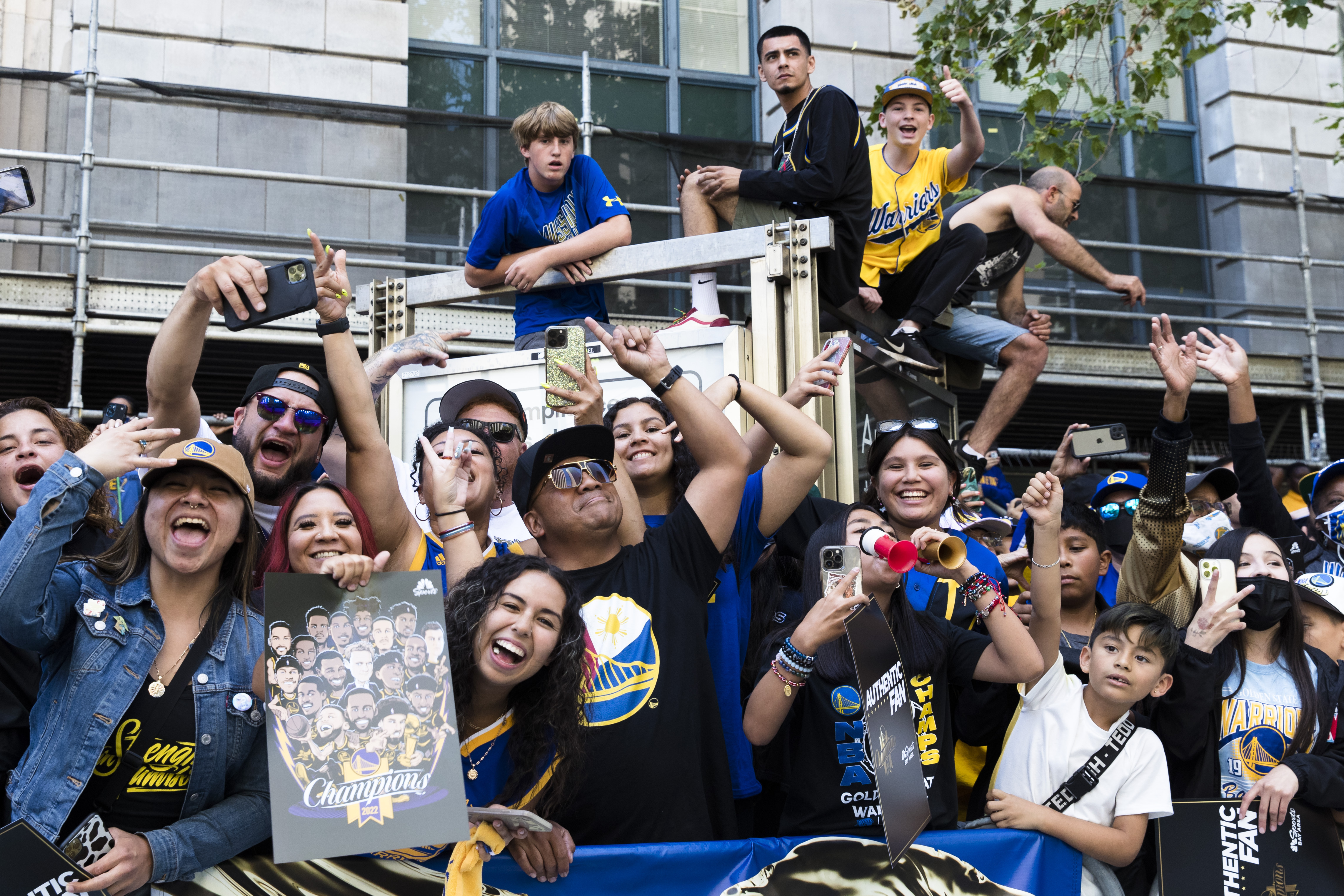 Fans cheer the Golden State Warriors during the NBA Championship parade in San Francisco, Monday, June 20, 2022, in San Francisco.