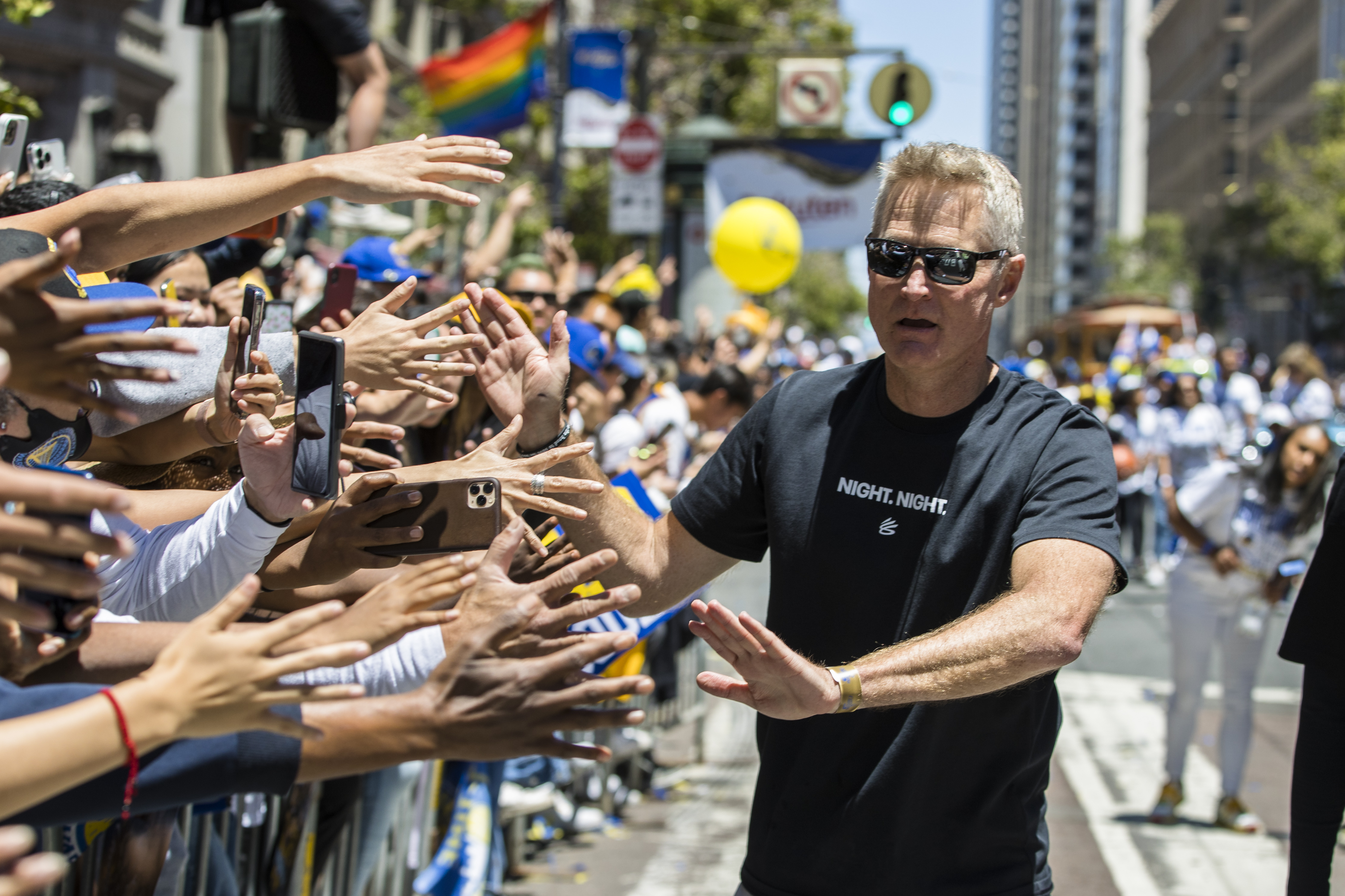 Golden State Warriors head coach Steve Kerr high-fives the crowd during the NBA Championship parade in San Francisco, Monday, June 20, 2022, in San Francisco.