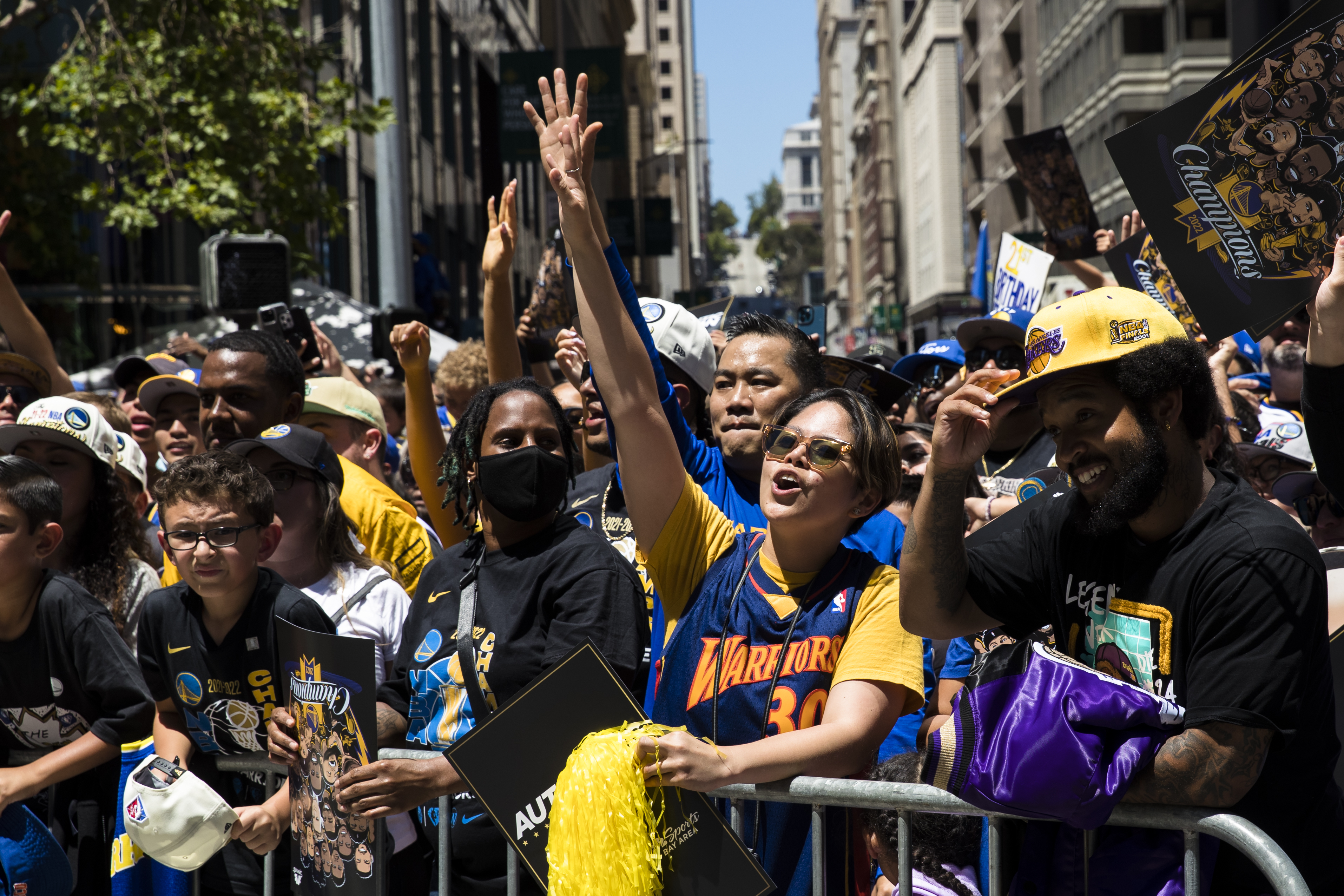 Fans cheer the Golden State Warriors during the NBA Championship parade in San Francisco on Monday, June 20, 2022.
