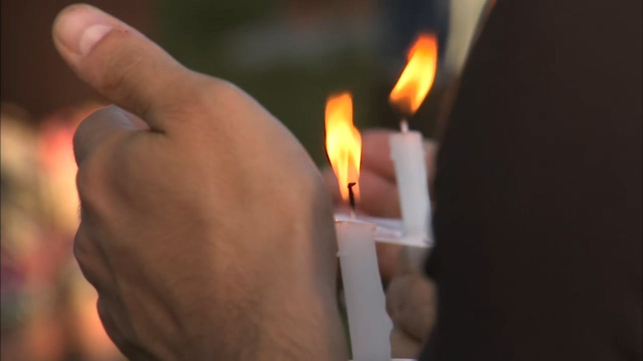 Highland Park holds vigil for shooting victims, survivors