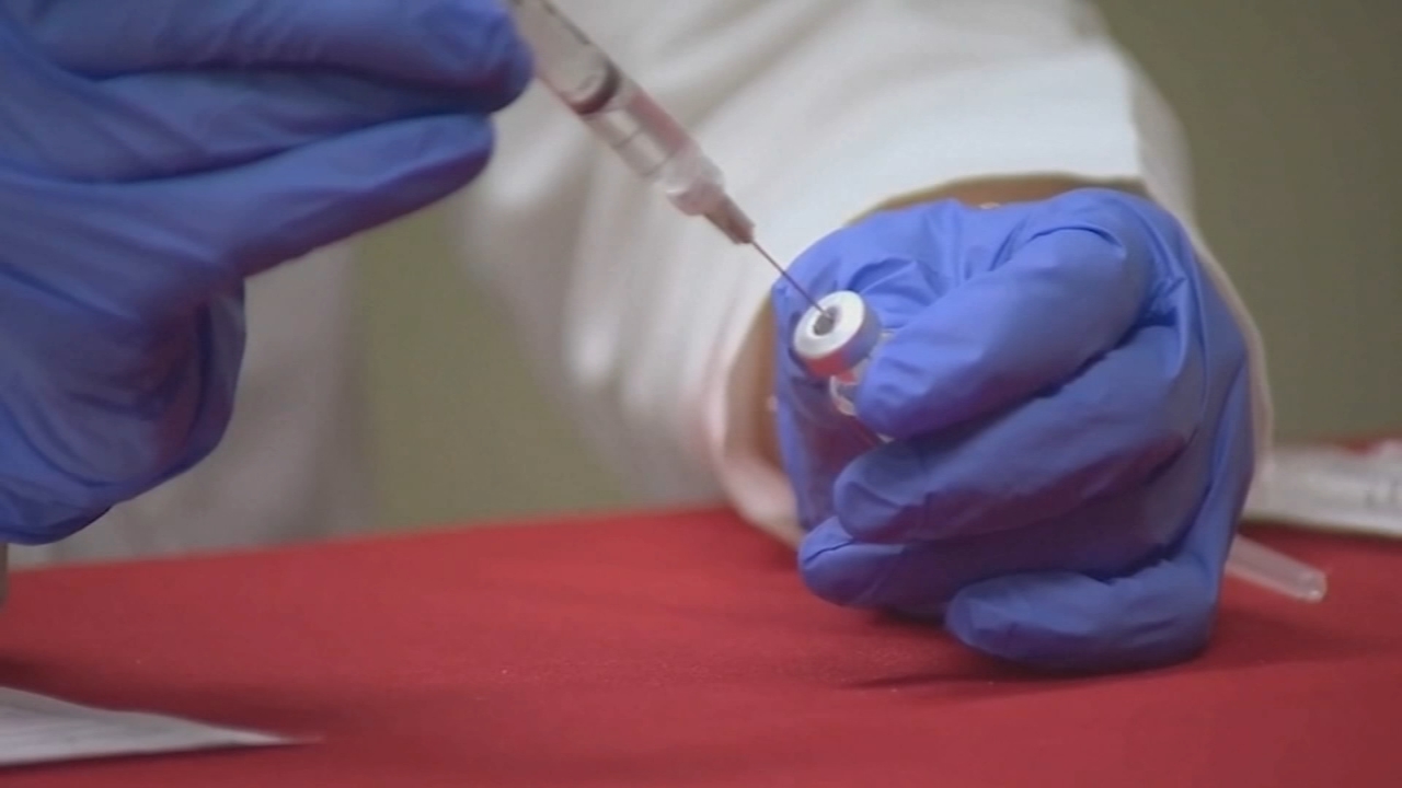 With incoming COVID surge, health officials push urgently for boosters