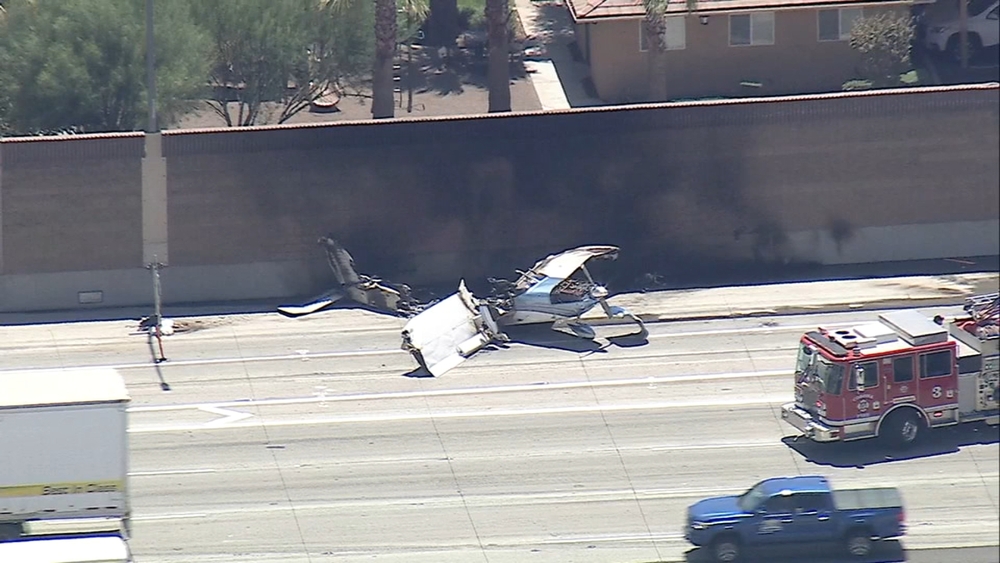 Plane crash lands on 91 Freeway in Corona, 2 escape uninjured