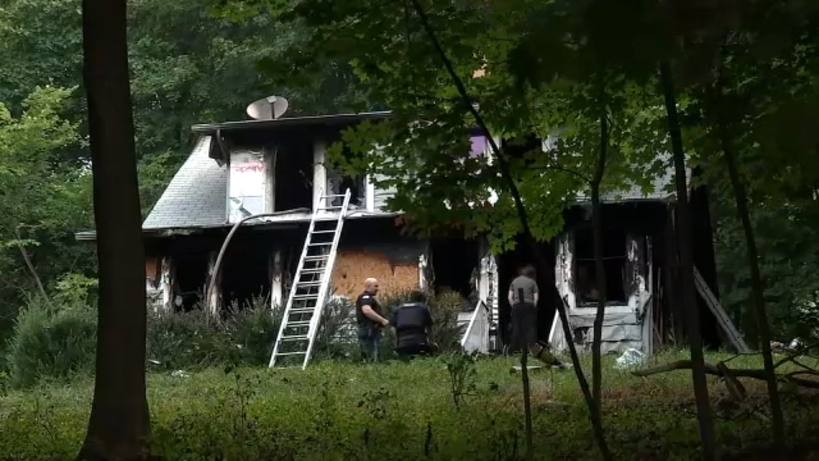 2 dead, back of home collapses when fire tears through house in