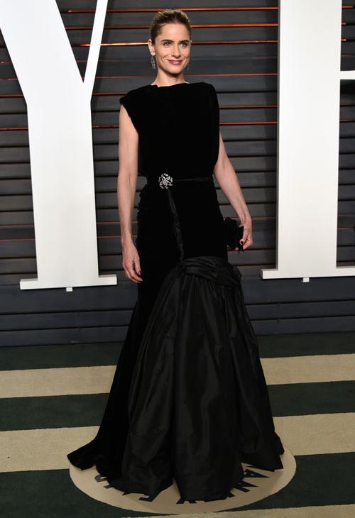 Amanda Peet arrives at the Vanity Fair Oscar Party on Sunday, Feb. 28, 2016, in Beverly Hills, Calif.