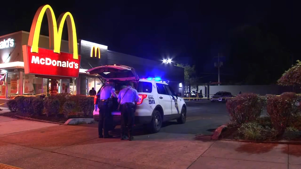 Gun battle in McDonald's parking lot injures man; suspects sought
