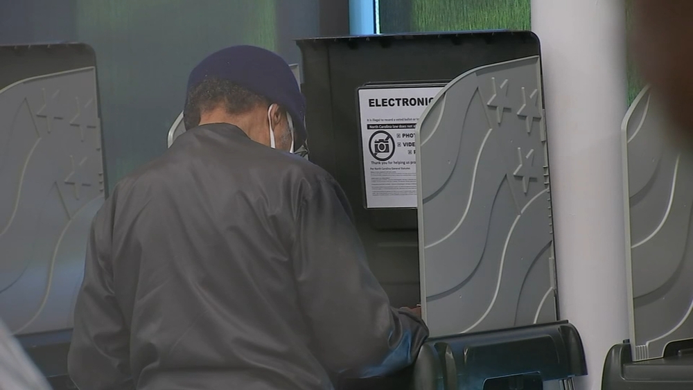 DOJ warns it won't tolerate voter intimidation in 2022 election