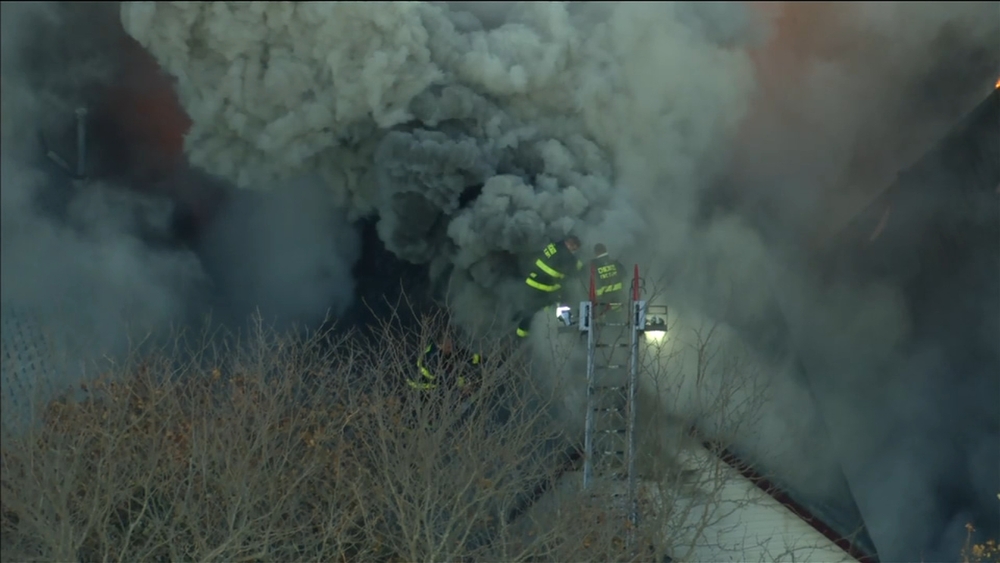 Flames force Chicago firefighters off Logan Square rooftop