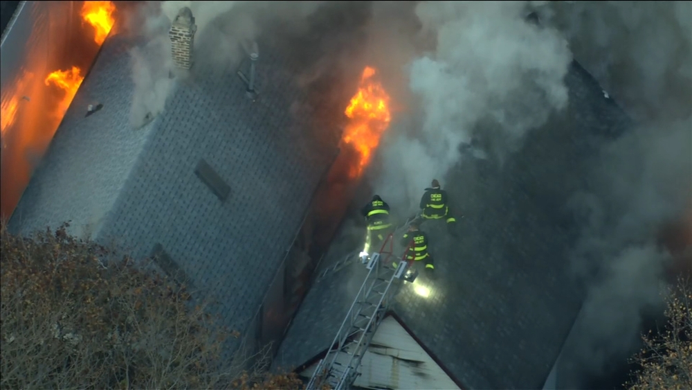 Firefighters battle extra-alarm fire from Logan Square rooftops