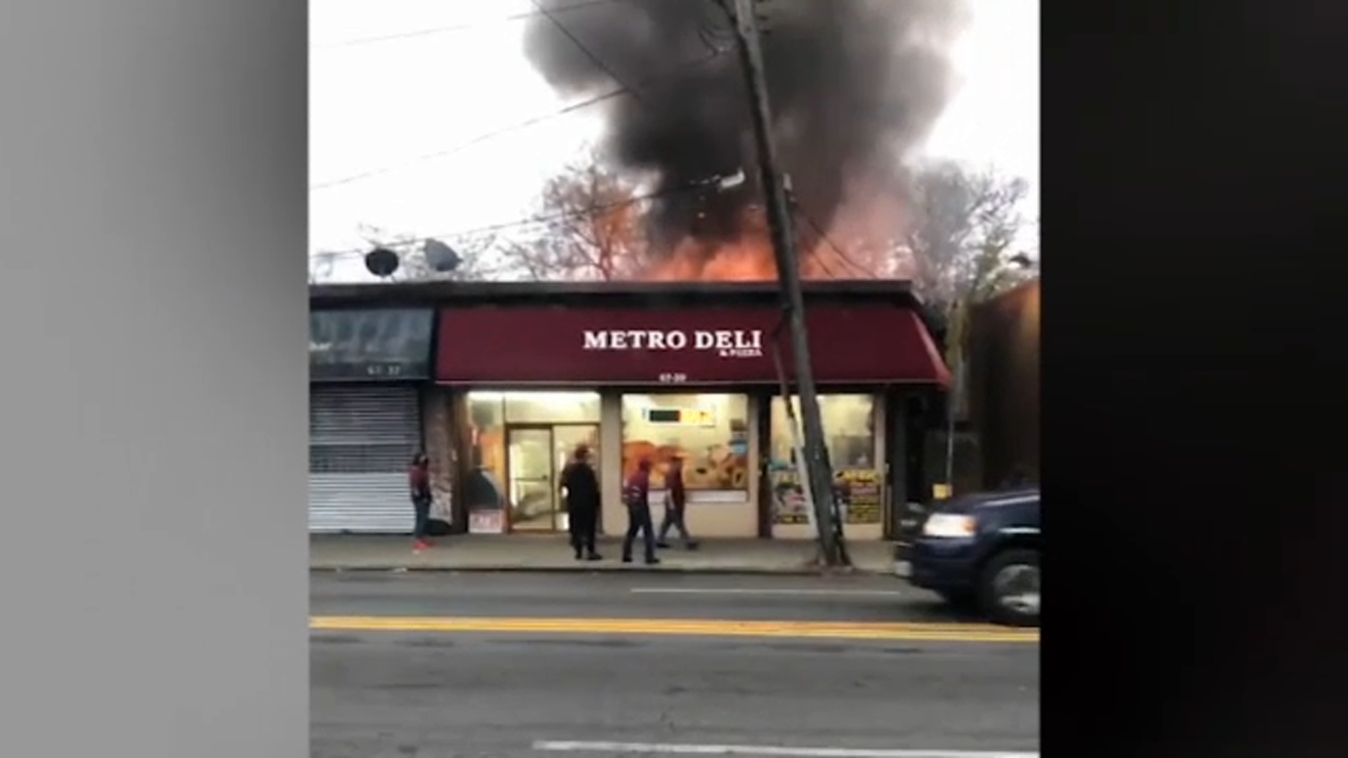 Fire bursts through roof of Maspeth Queens deli