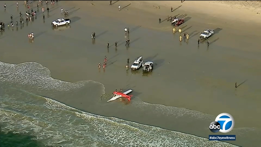 Small plane crashes, flips over on Santa Monica beach