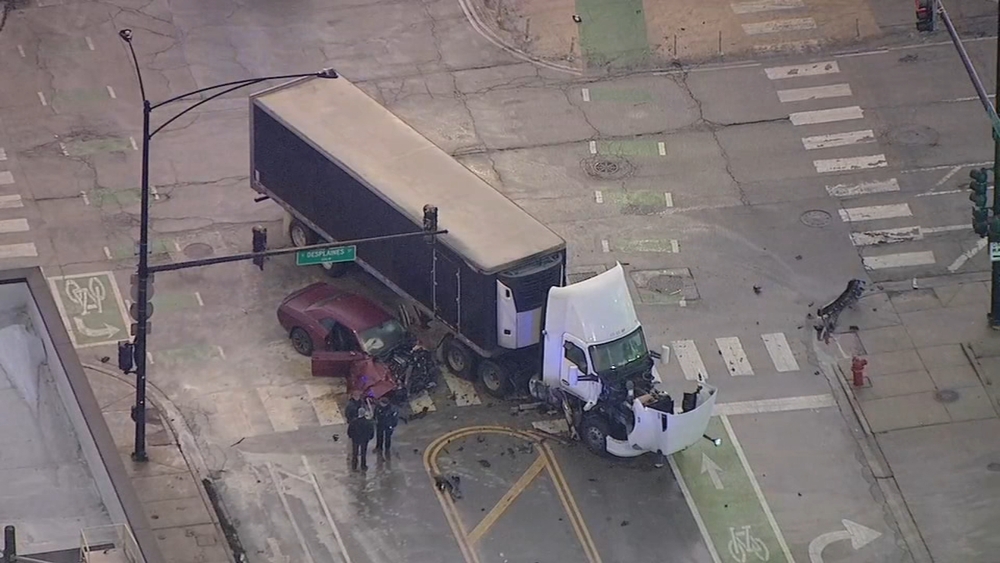 Shots fired after car slams into semi in South Loop