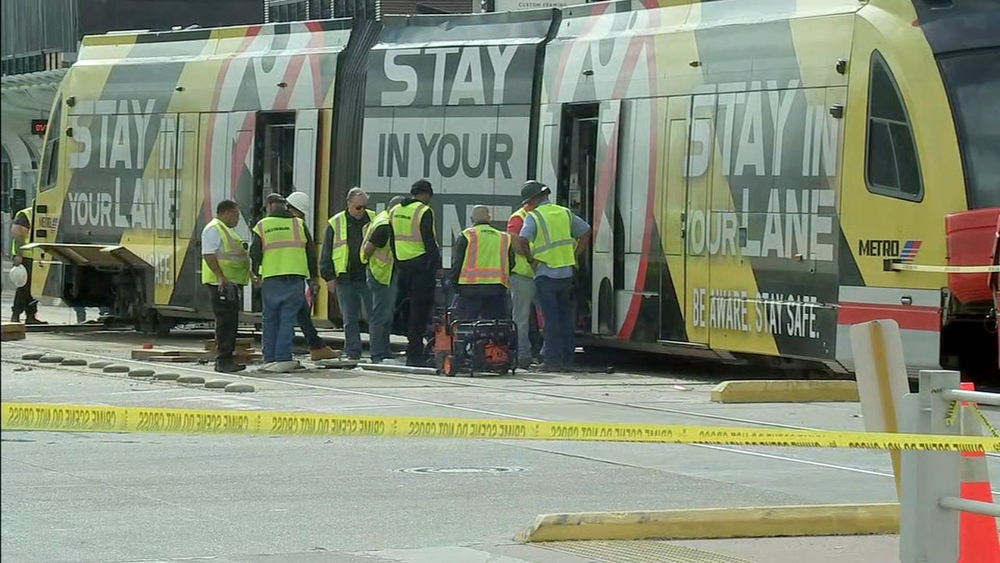 METRORail train derails in crash with suspect in stolen car, HPD says