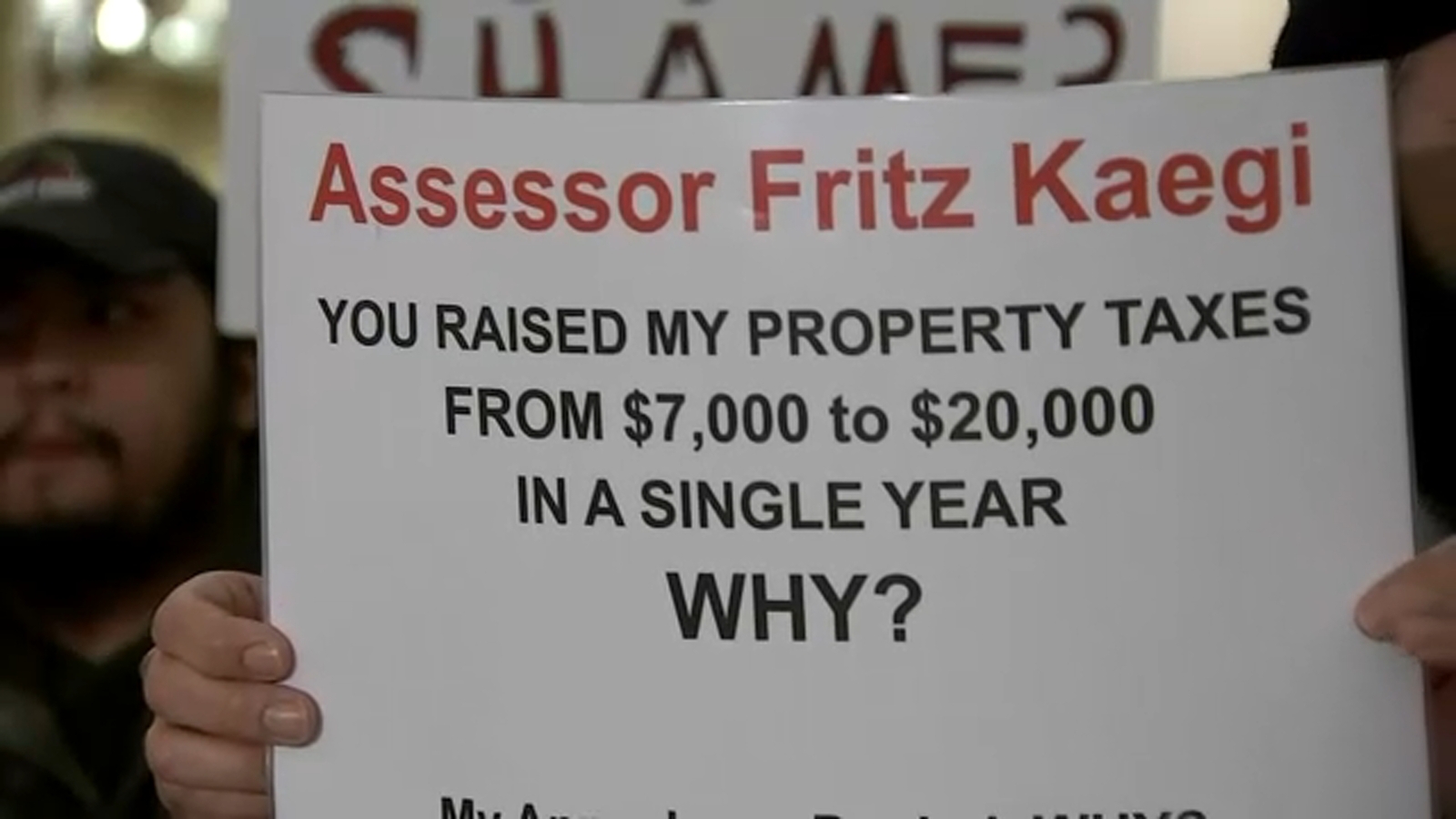 Chicago residents protest outside Assessor Fritz Kaegi's office after
