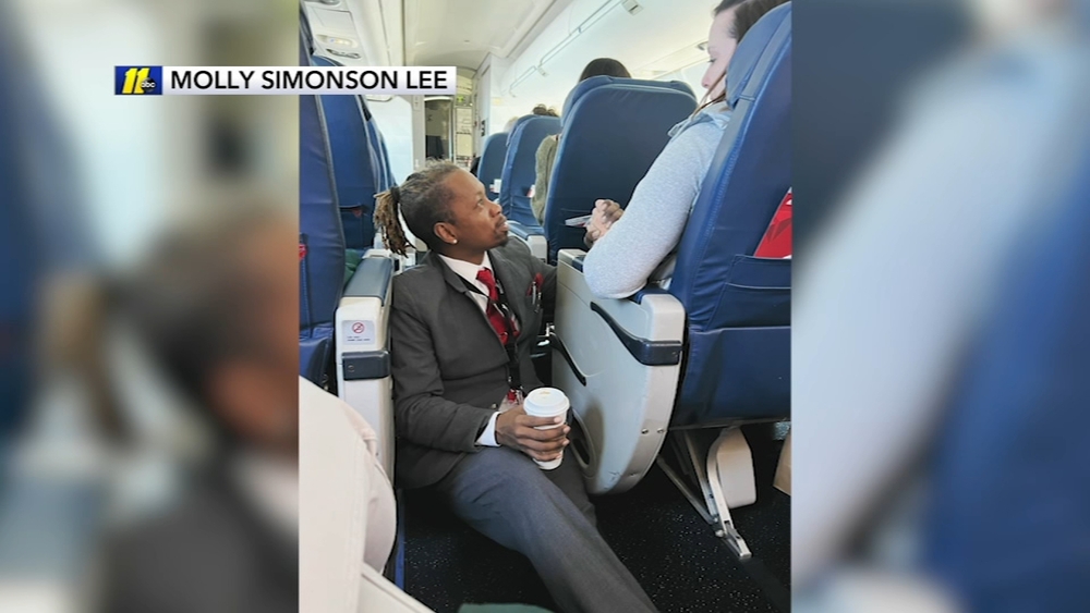 Flight attendant consoling passenger during turbulence goes viral