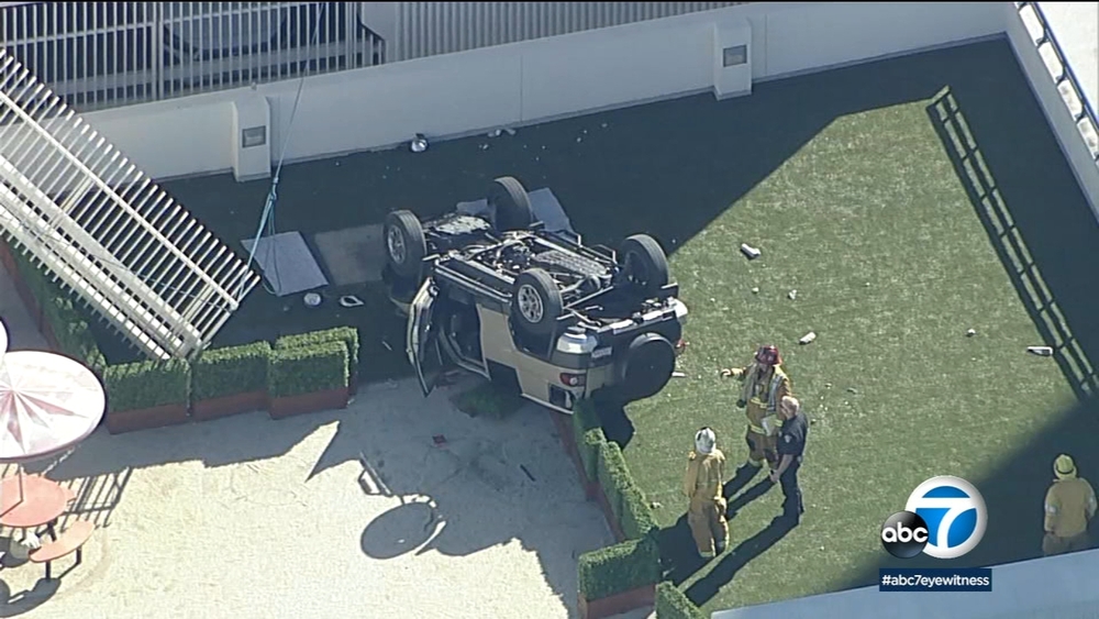 Vehicle drives off edge of parking structure at OC hospital, overturns