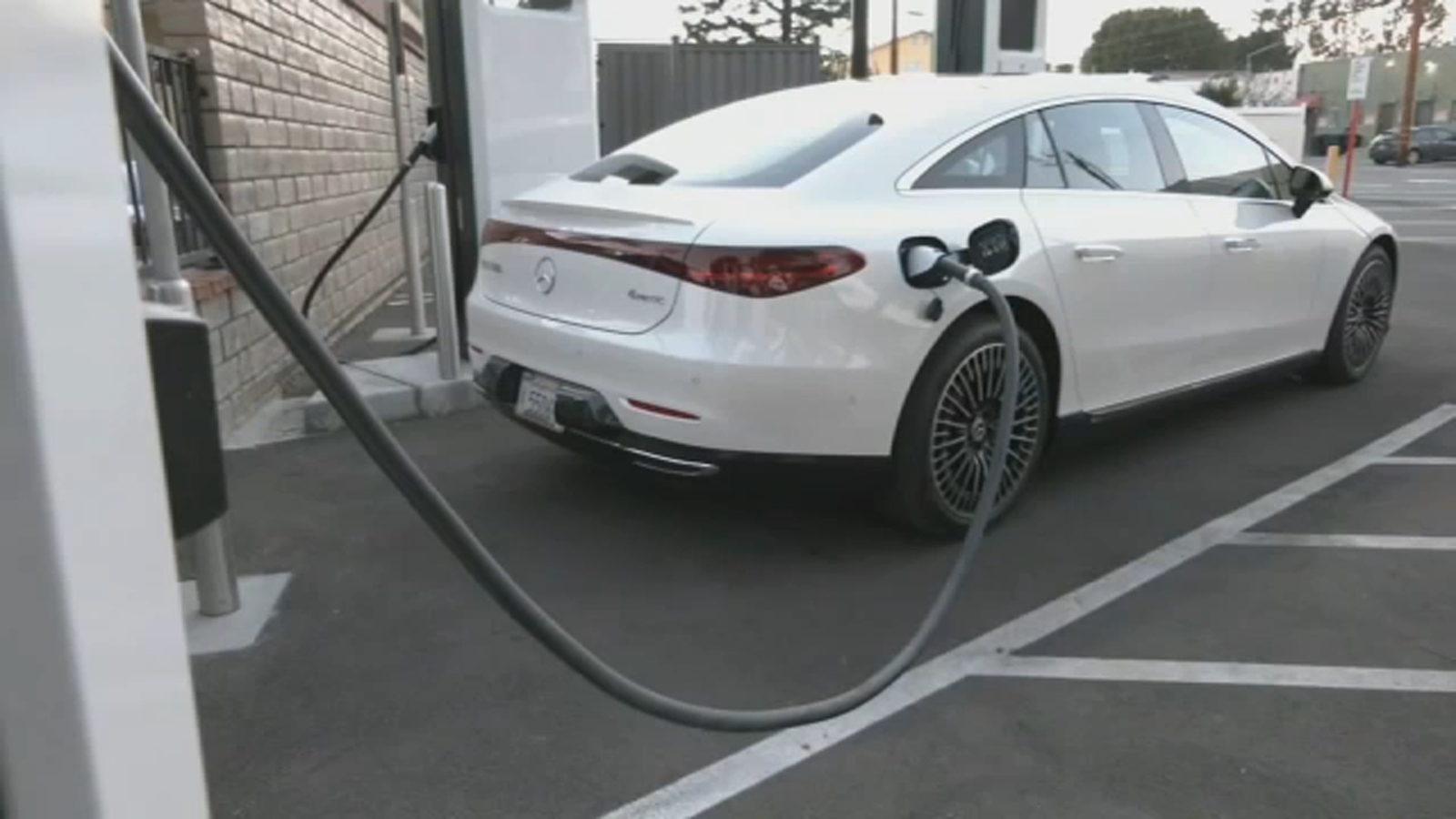 EV chargers Tesla to open some of its charging stations as Biden seeks