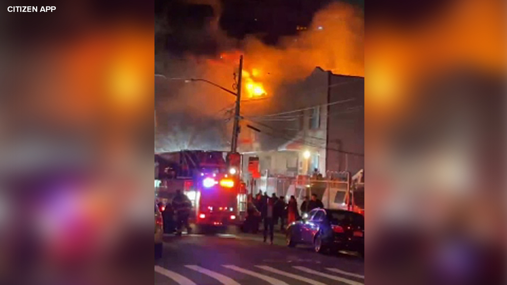 8 firefighters hurt as fire rips through 3 homes in Queens