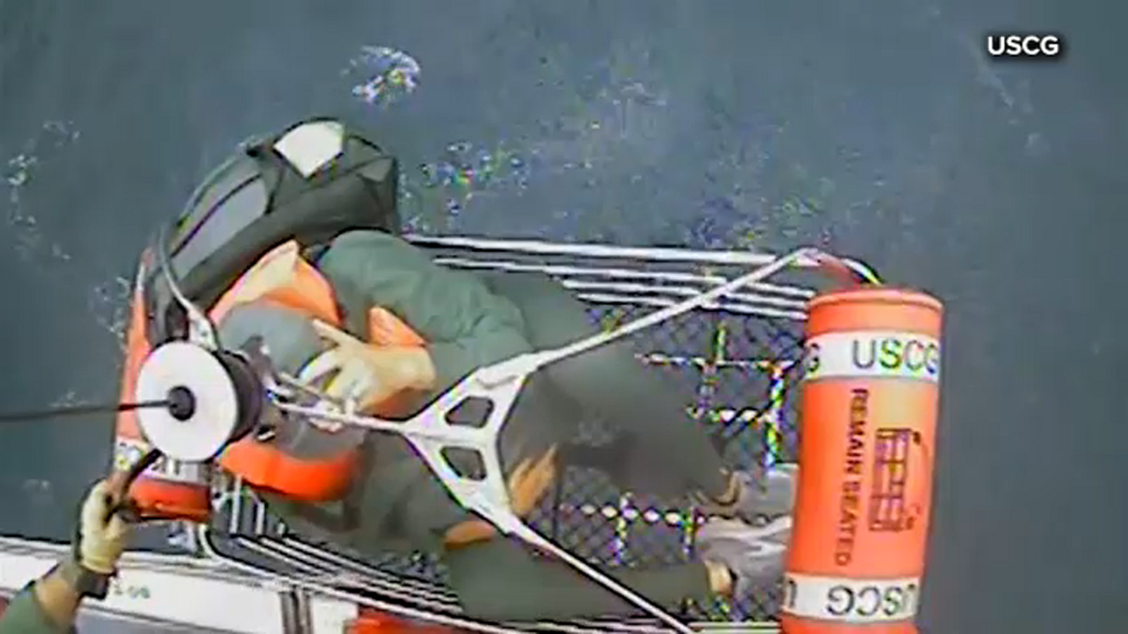 Water rescue: 2 people and a cat rescued by US Coast Guard from ...