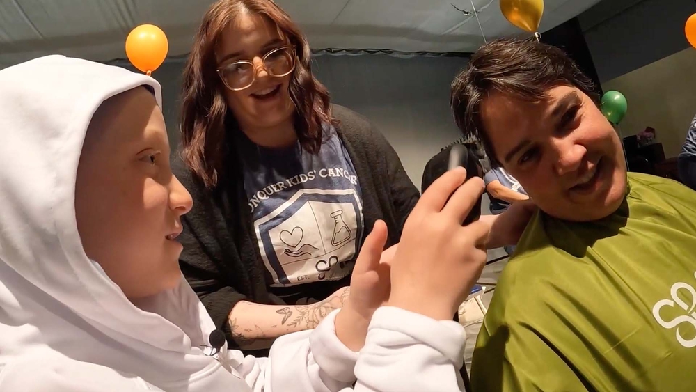 Young cancer survivor helps shave heads for St. Baldrick's Foundation