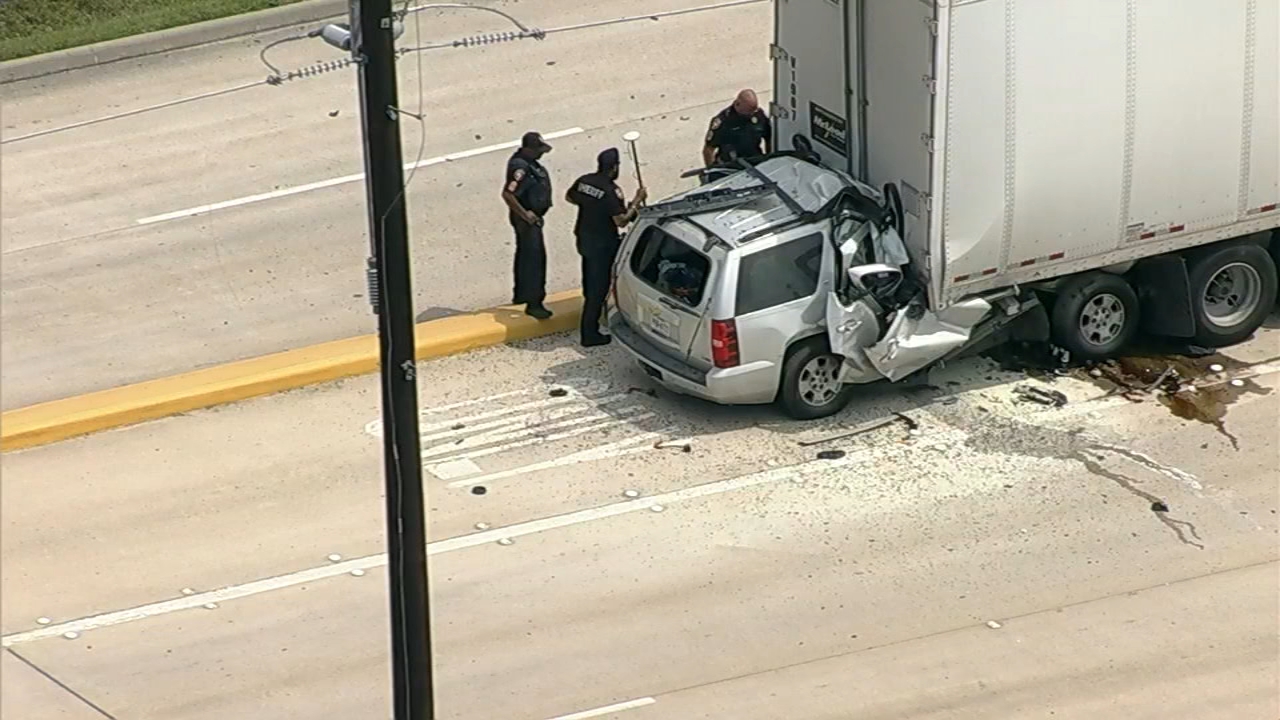 SUV wedged underneath semi, killing 1