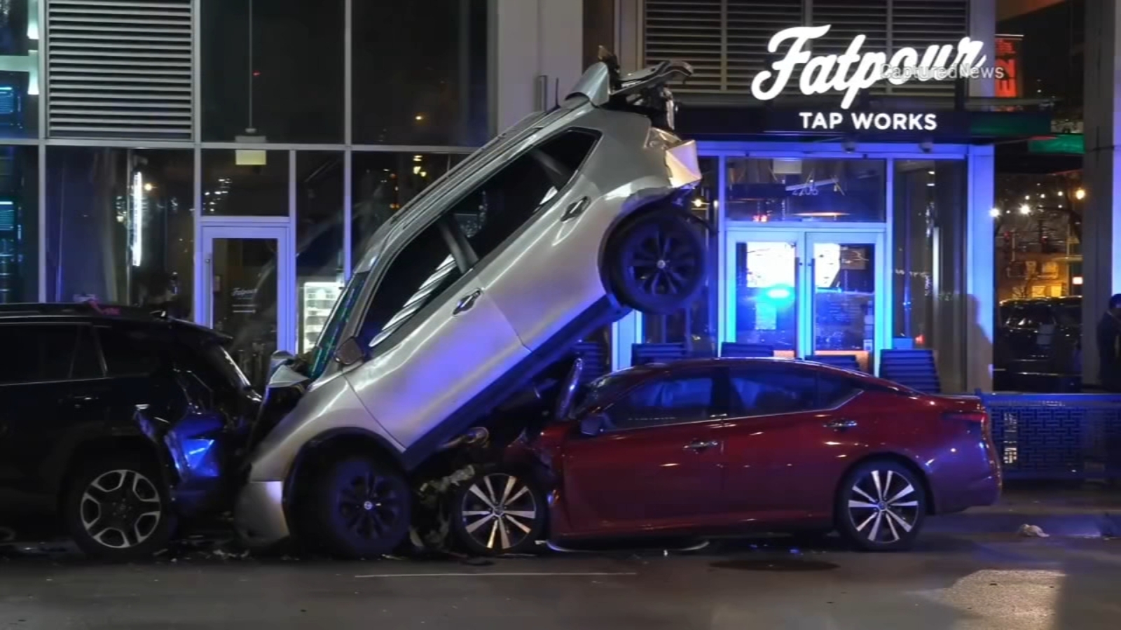 Car ends up wedged under parked car in South Loop driver injured police say Car ends up wedged under parked car in South Loop driver injured police say