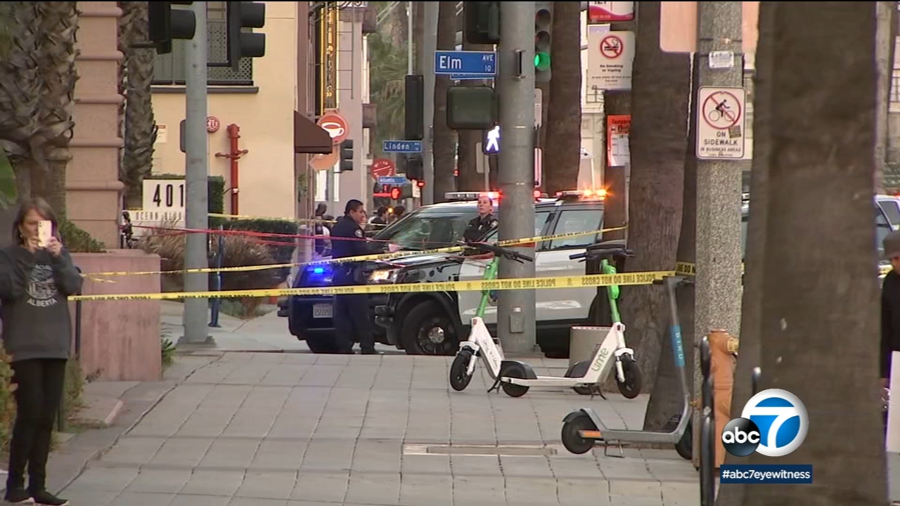 Officer shoots armed suspect outside LB Grand Prix, causing stampede