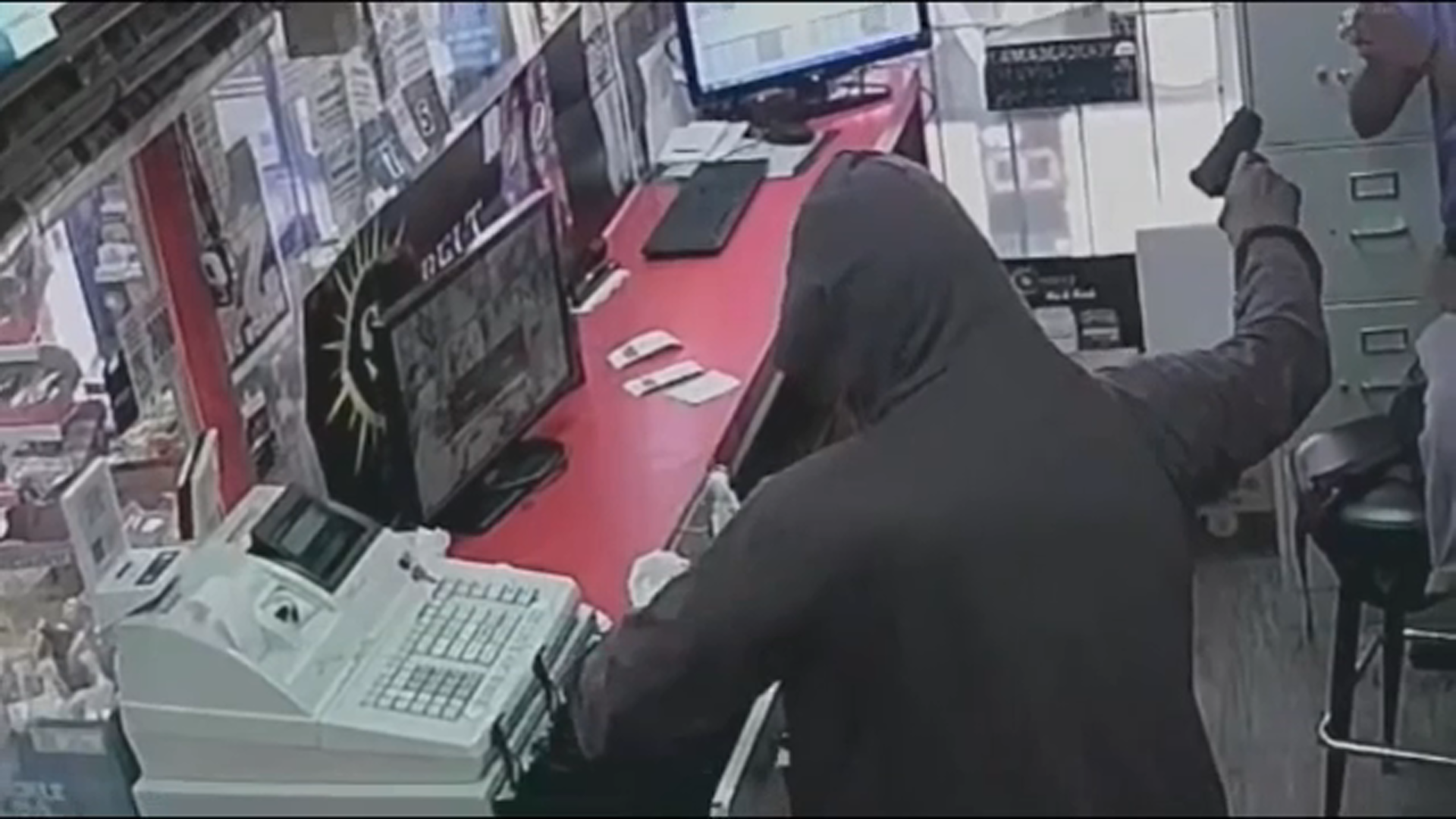 Video shows thieves force workers get on ground as they take cash