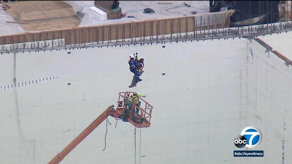 Men rescued from cherry pickers after collapse at construction site