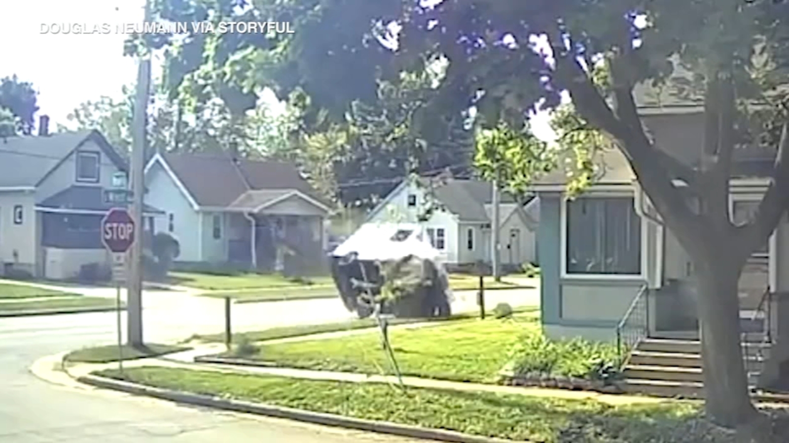 USPS mail truck flips in Waukesha, Wisconsin crash; neighbor jumps in