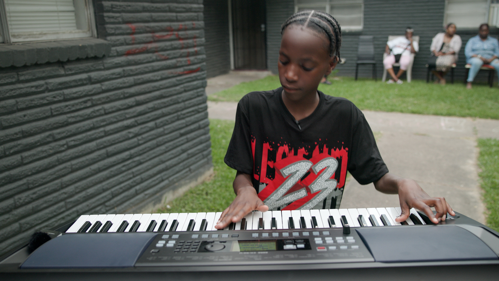 Kid musician hitting the right note