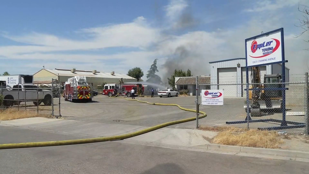 Firefighters contain fire at towing yard near airport in Fresno