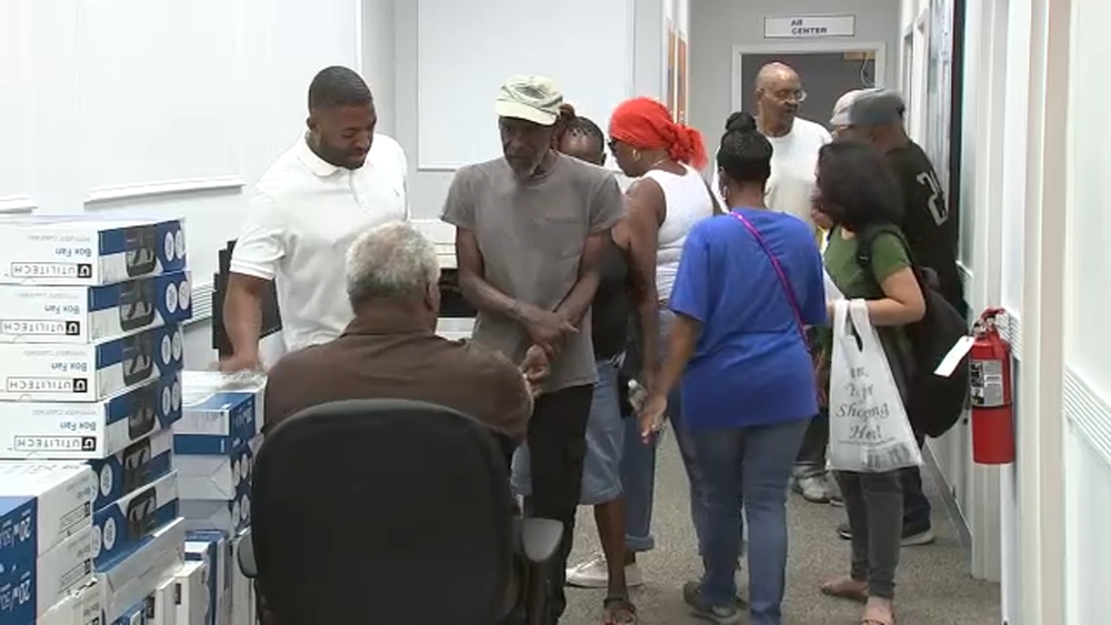 State Rep. Amen Brown hands out free fans to residents in Powelton