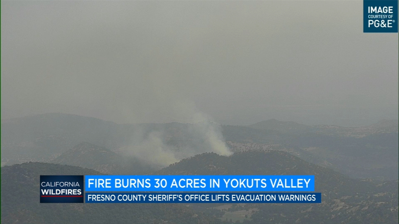 Firefighters work to contain wildfire in Yokuts Valley