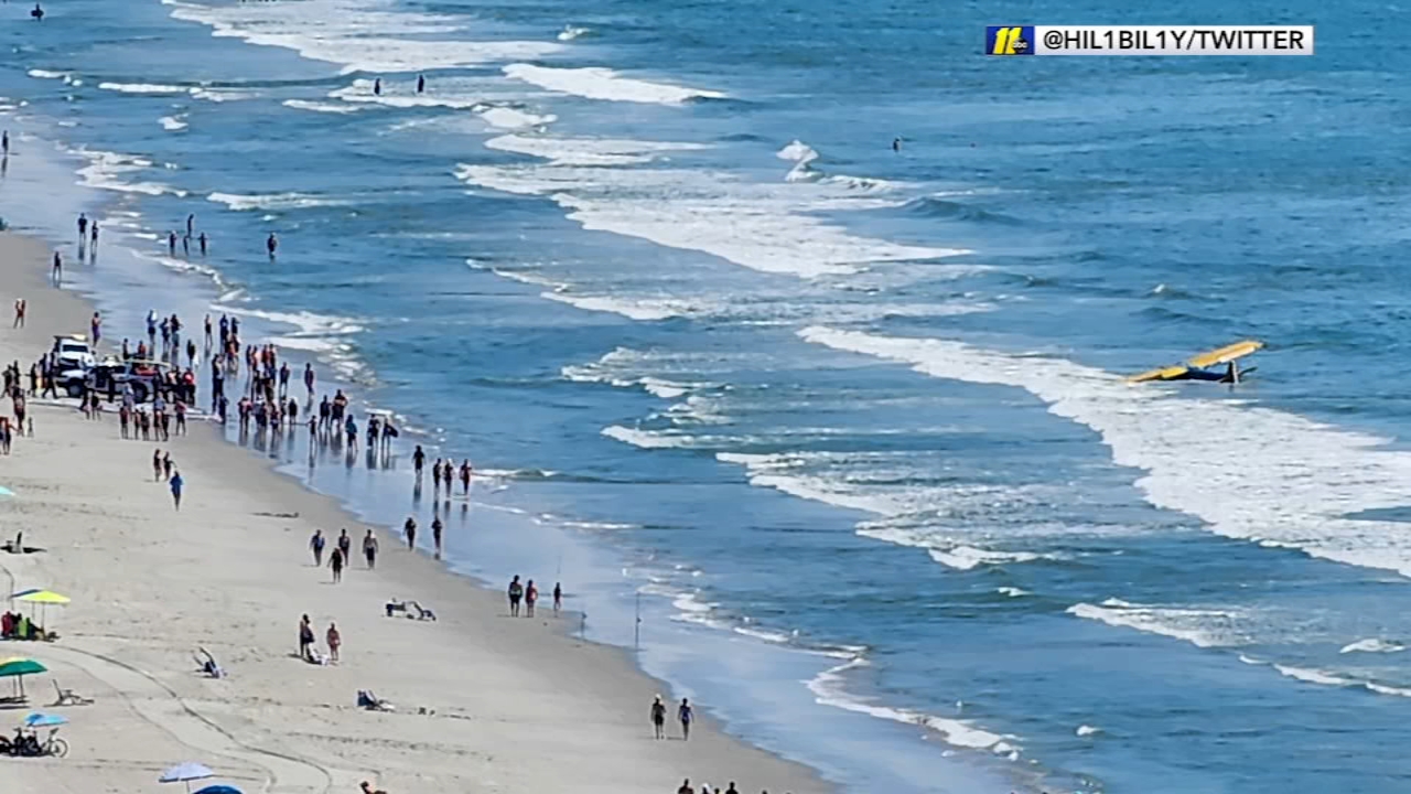 Airplanes crash into the ocean near beachgoers