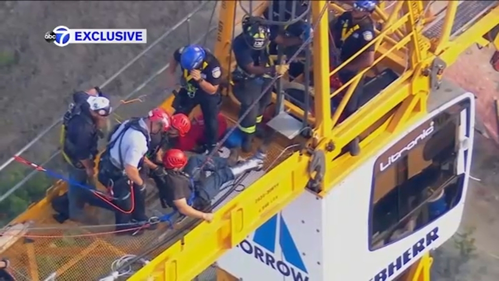 Man rescued from crane after suffering leg injury in White Plains