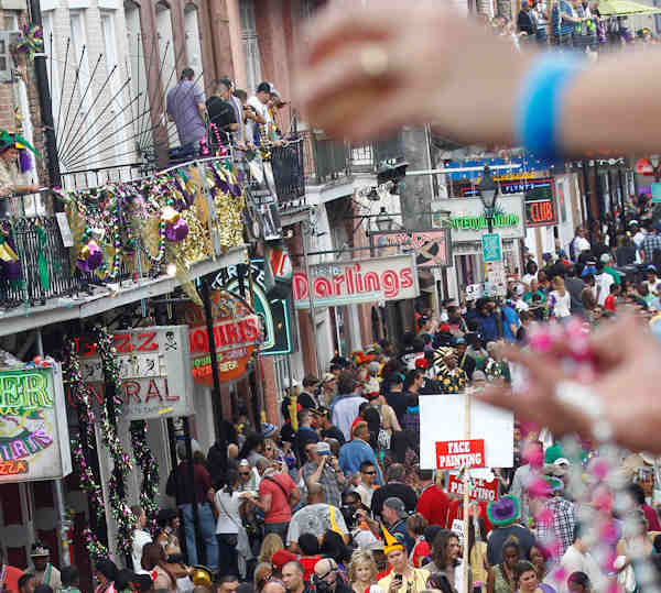 Mardi Gras revelers jam Bourbon Street in the French Quarter of New Orleans, Tuesday, Feb. 21, 2012. This is the last day of the Mardi Gras celebration ending at midnight, after a day long celebration of parades, marching groups and people in costumes. (AP Photo/Bill Haber)