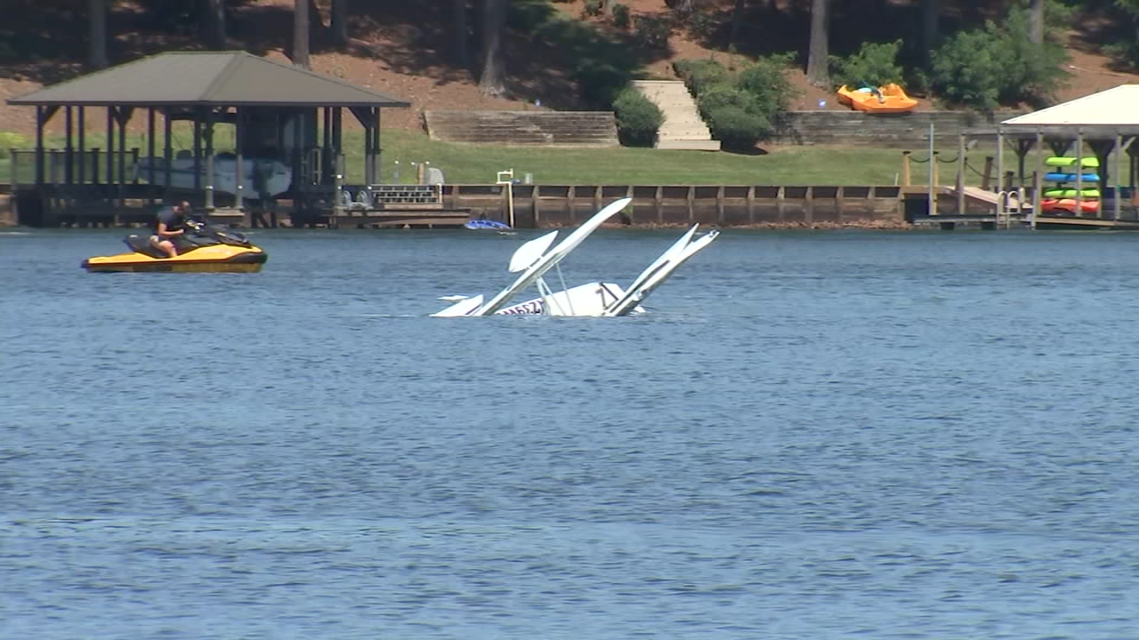Plane hits power lines, crashes into Lake in Hickory; 2 killed