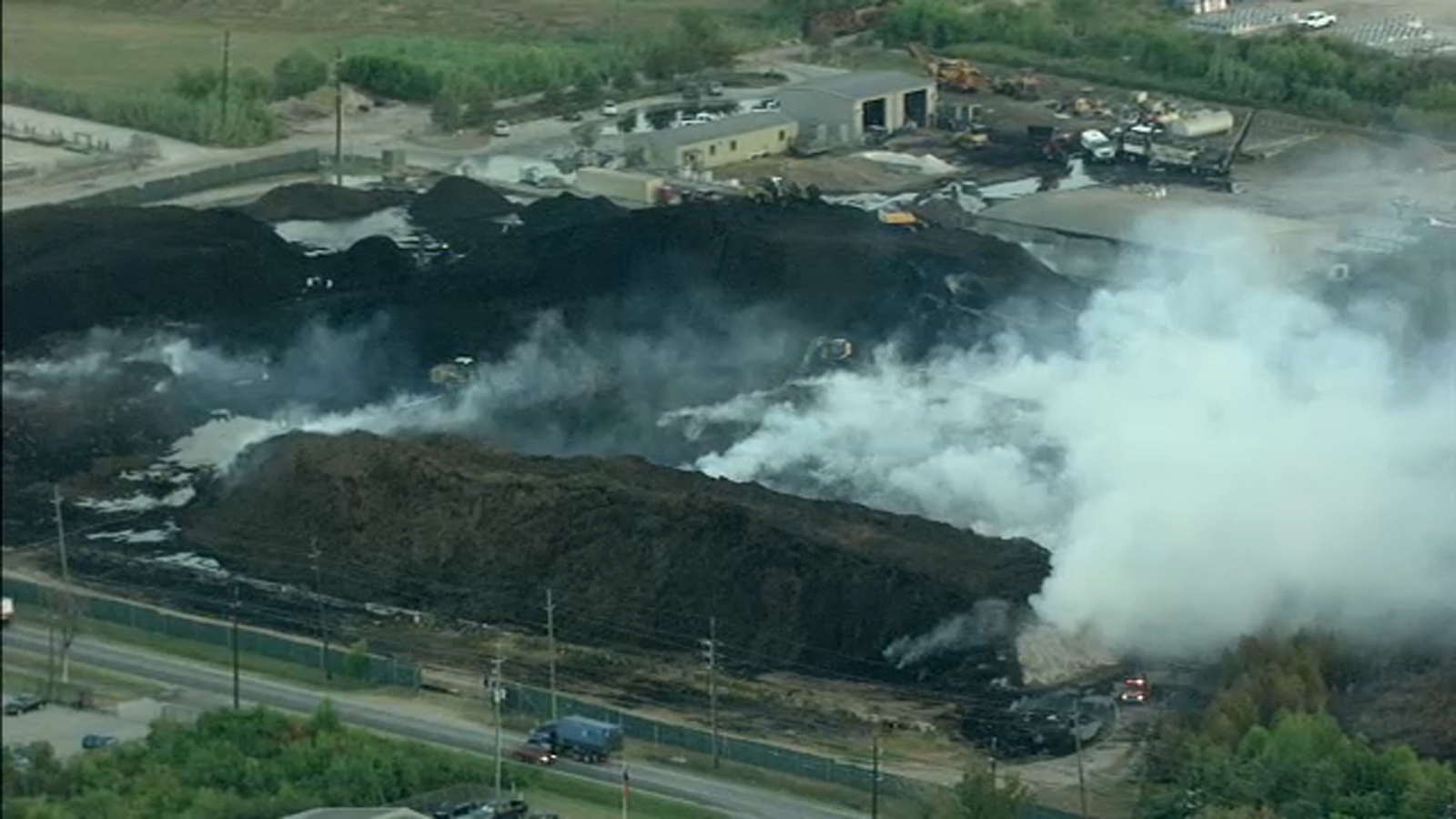 Houston mulch fire Flames burn at Living Earth landscaping facility on Crawford Road for 3rd