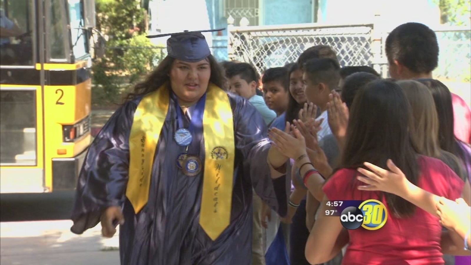 Fresno Unified high school seniors take a walk in their cap and gowned