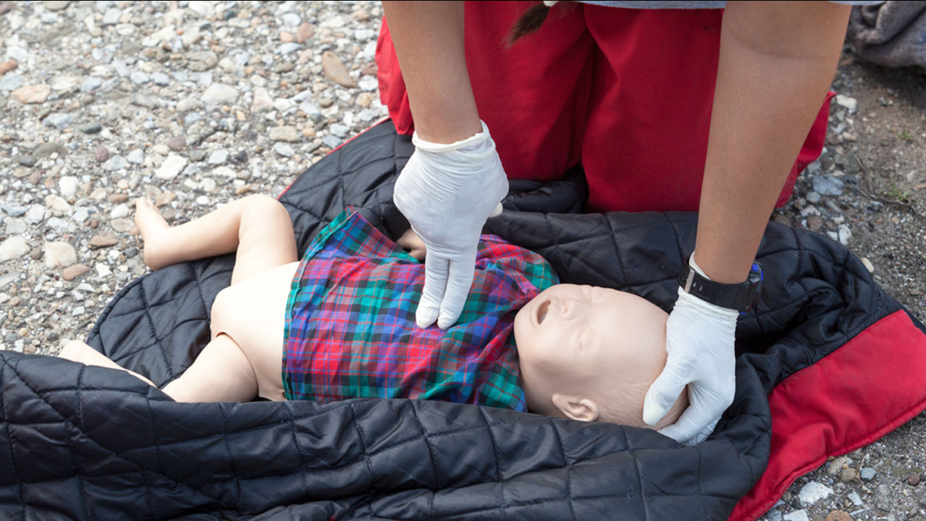 A person administers CPR on an infant doll in an undated file image.