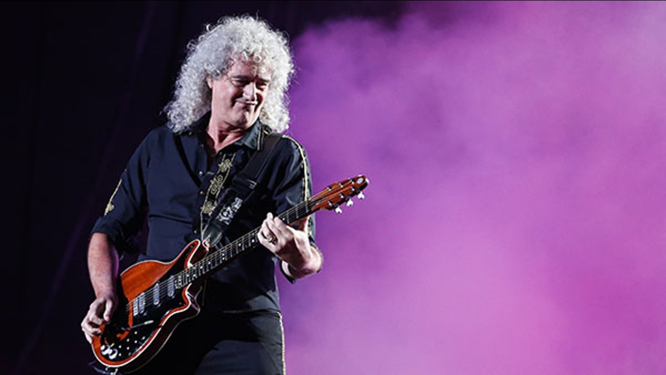 Brian May of the Queen + Adam Lambert performs at the Rock in Rio music festival in Rio de Janeiro, Brazil, early Saturday, Sept. 19, 2015.