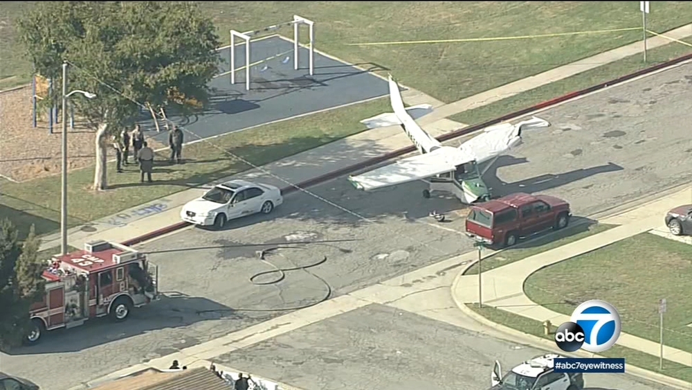 Small plane crashes on street in Compton, hits car parked near airport