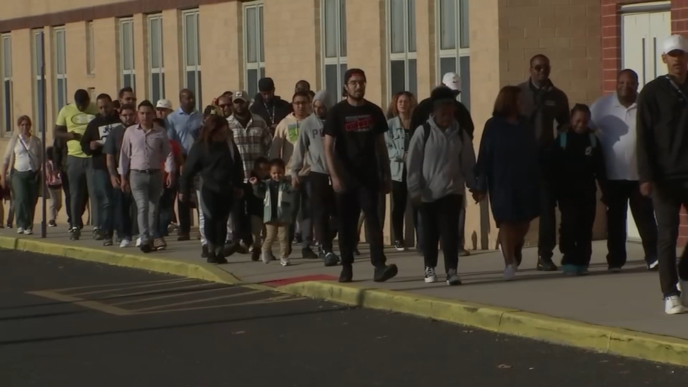 Dads, father figures set example in Camden at walk to school event