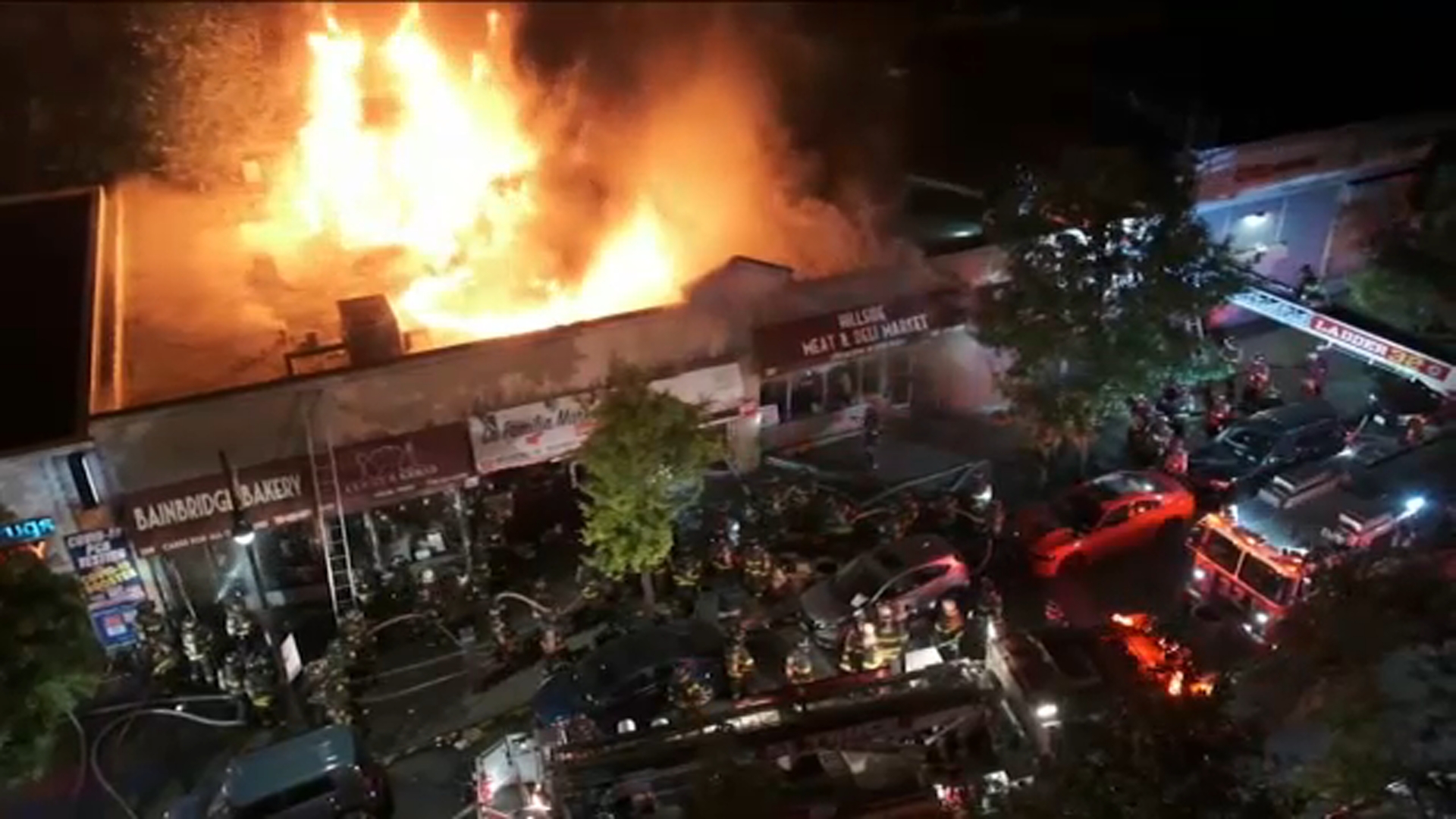 Firefighter injured as flames burn through row of Bronx businesses