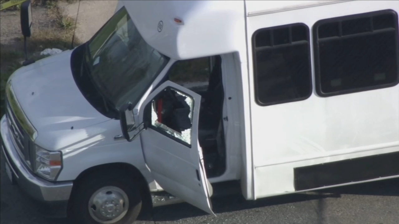 Bus with 12 passengers on board caught in crossfire, driver wounded