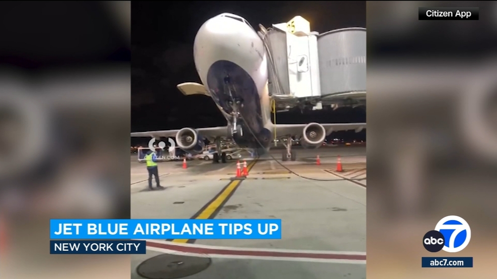 JetBlue plane tilts up as passengers disembark at JFK Airport