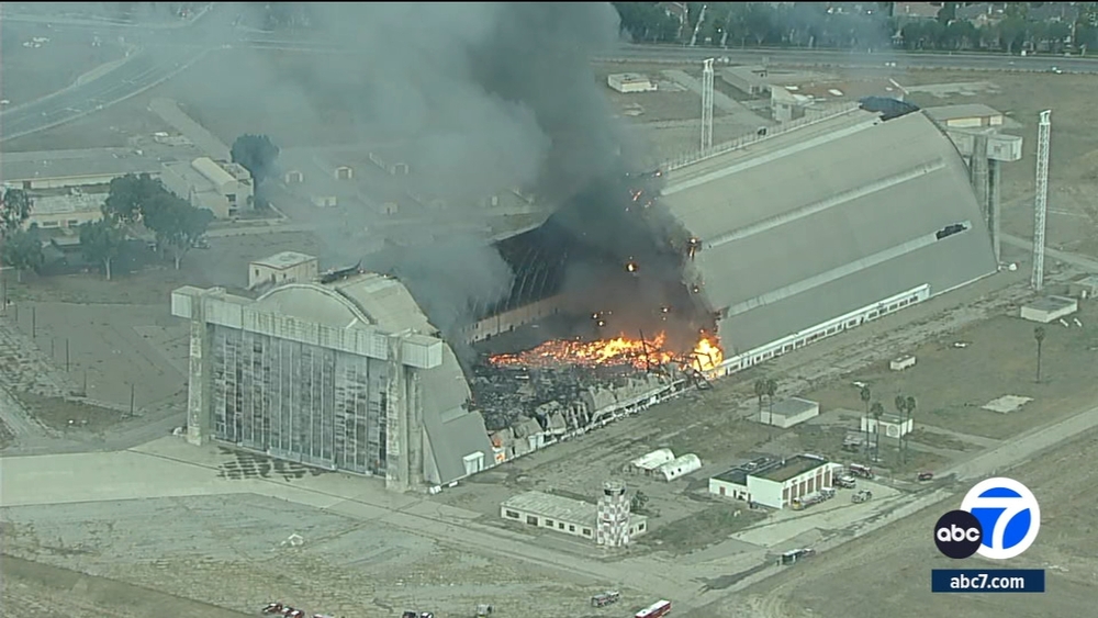 Massive fire burns through historic hangar in Tustin