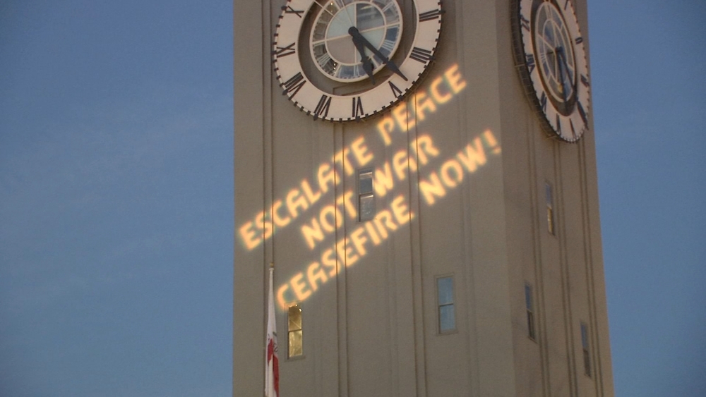 Israel-Gaza cease fire message projected on SF's Ferry Building