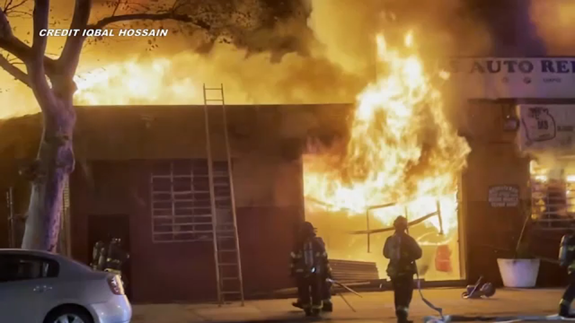 Firefighter injured in massive fire at Queens auto repair shop